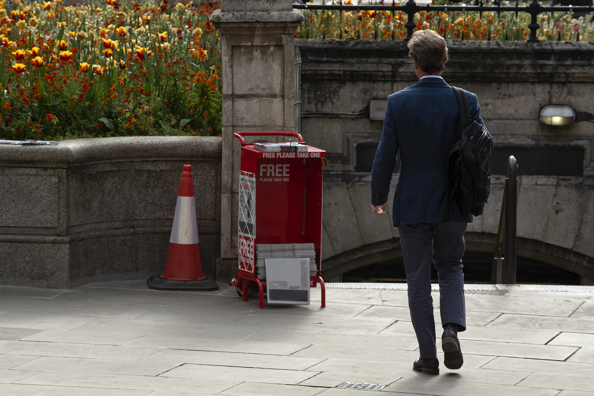 A man walking in London with business-casual wear