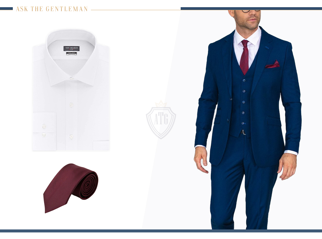 Matching a blue three-piece suit with a white dress shirt and a burgundy tie