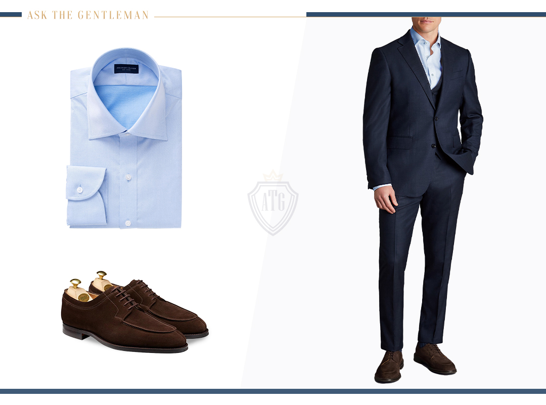 Matching a navy suit with a light blue shirt and brown shoes