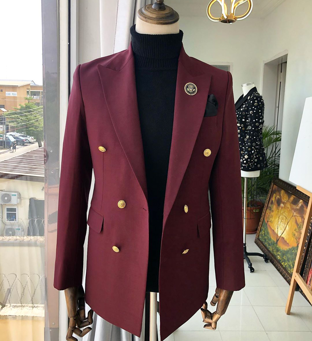 Matching black turtleneck with a burgundy suit jacket