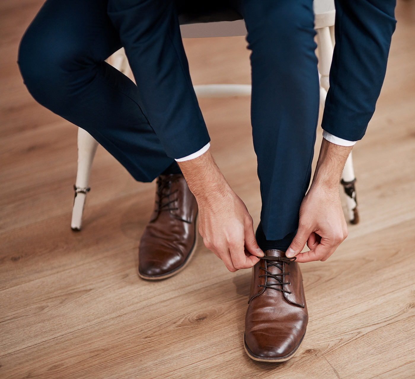 Matching dark blue pants and dark brown shoes