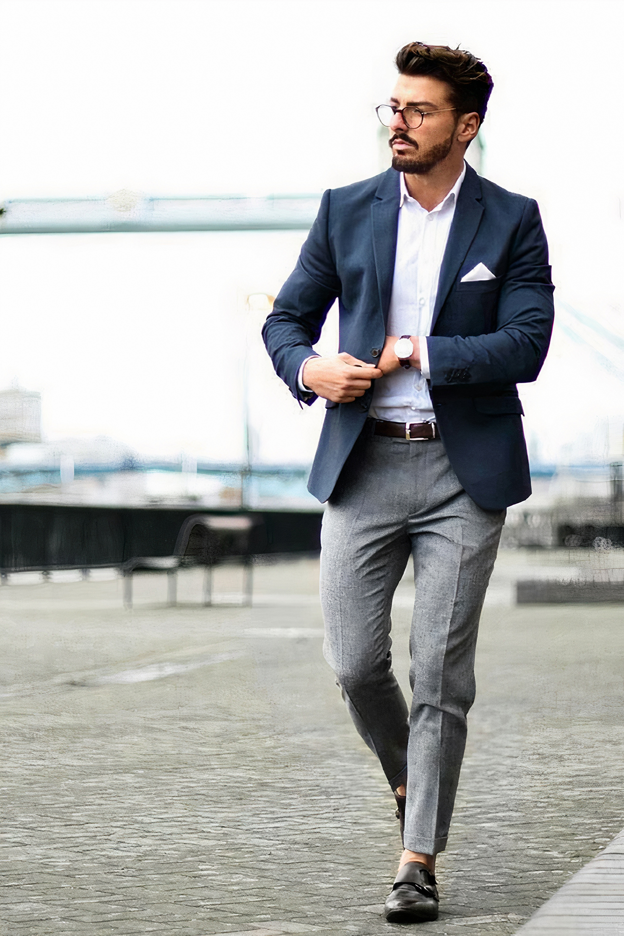 Navy blazer and grey pants with a white shirt and black monk straps