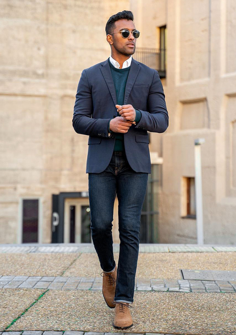 Navy blazer, blue crew neck sweater, white shirt, and dark blue jeans