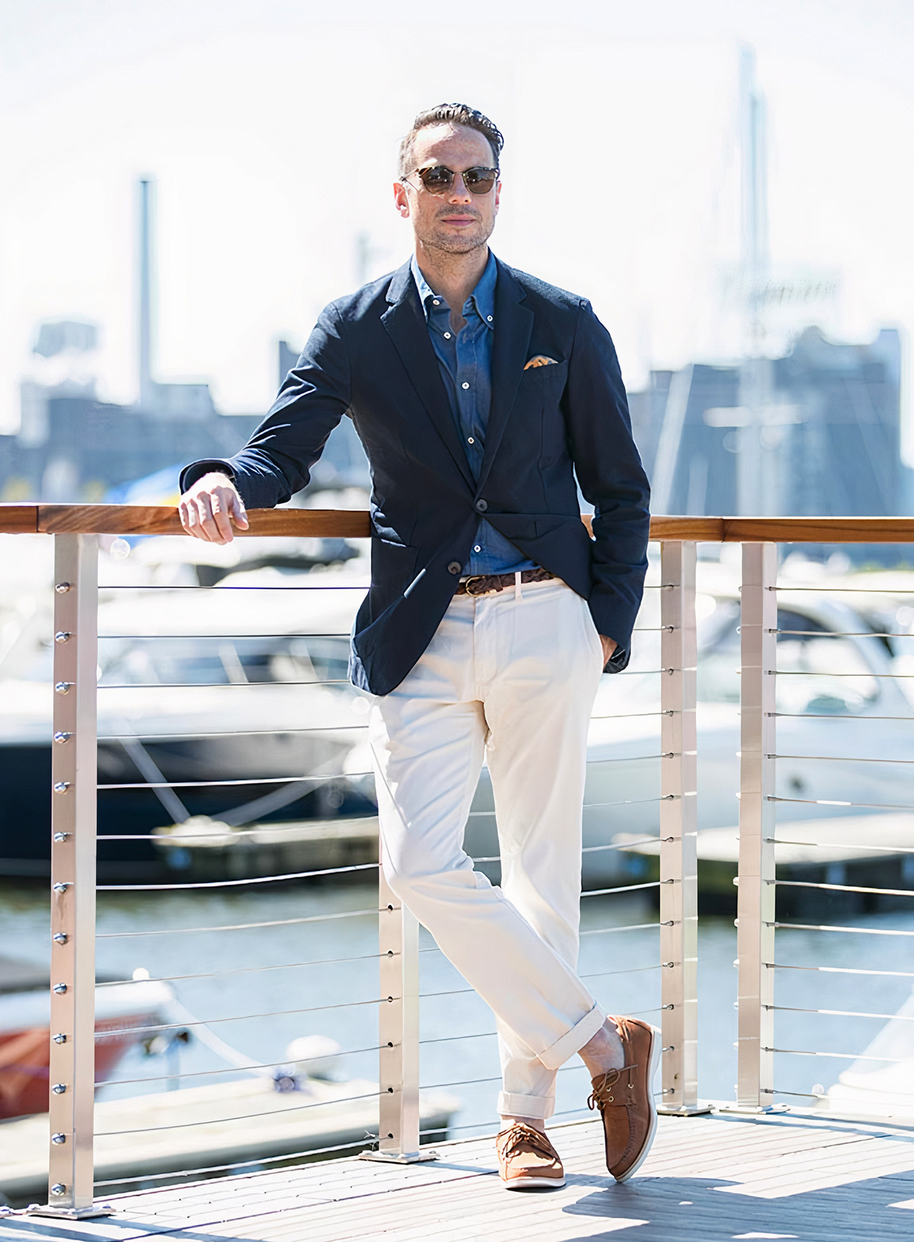 Navy blazer, denim button-down shirt, white chinos, and brown boat shoes