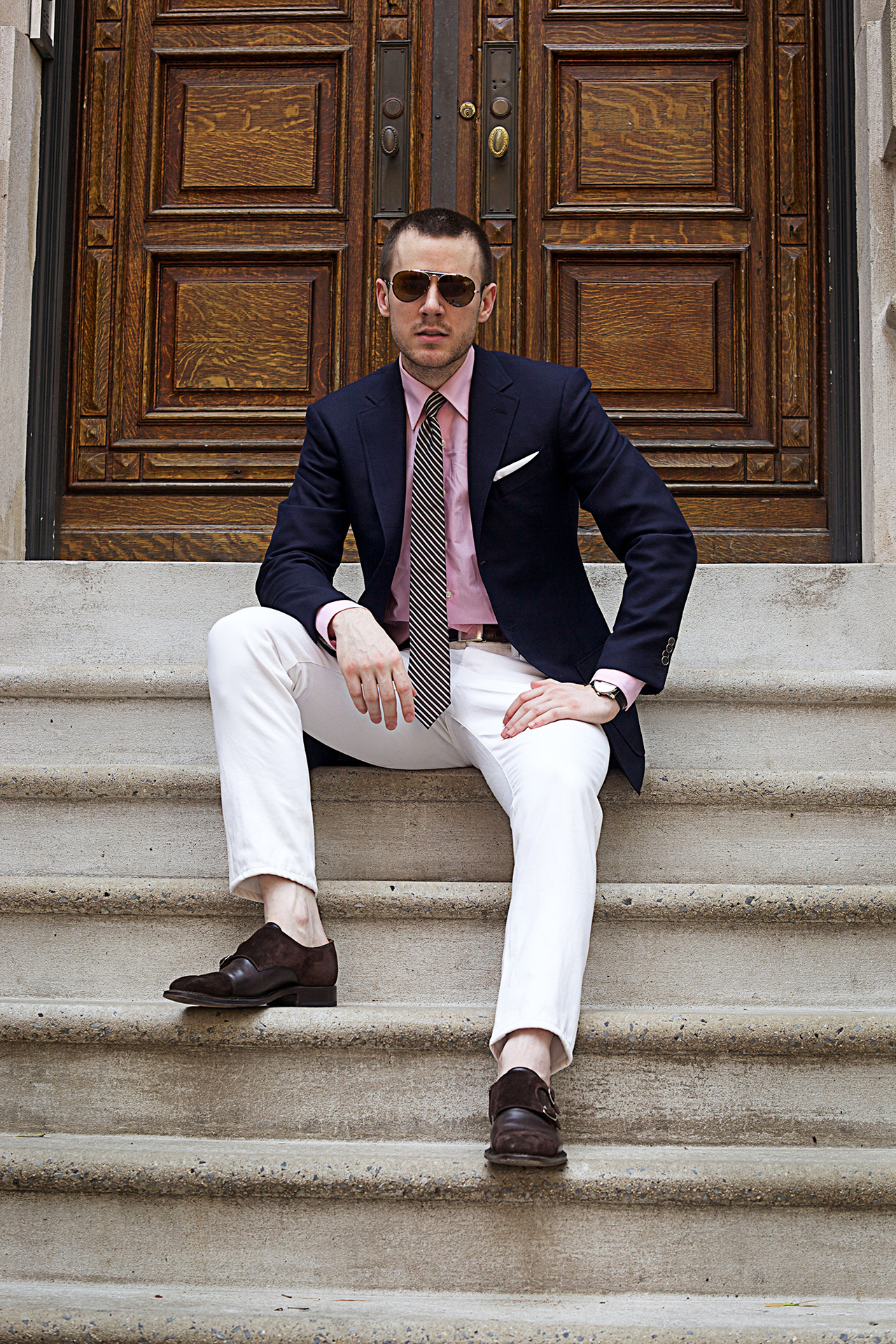 Navy blazer, pink shirt, white pants and striped tie