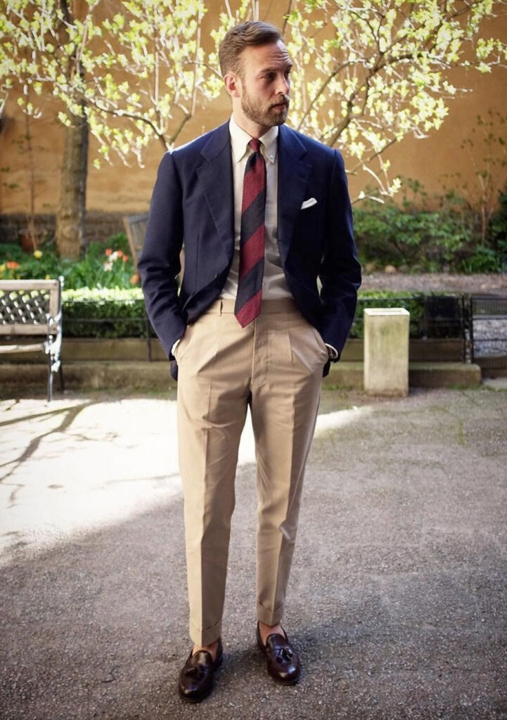 Navy blazer, white shirt, tan pants, and brown loafers