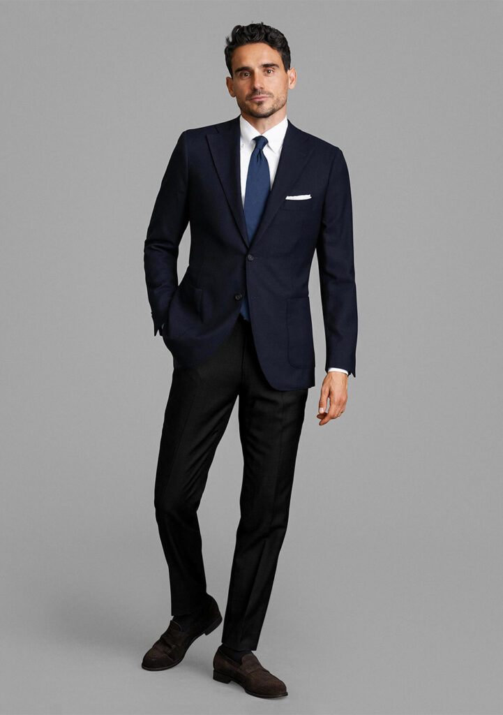 Navy blazer, black dress pants, navy tie, and white dress shirt