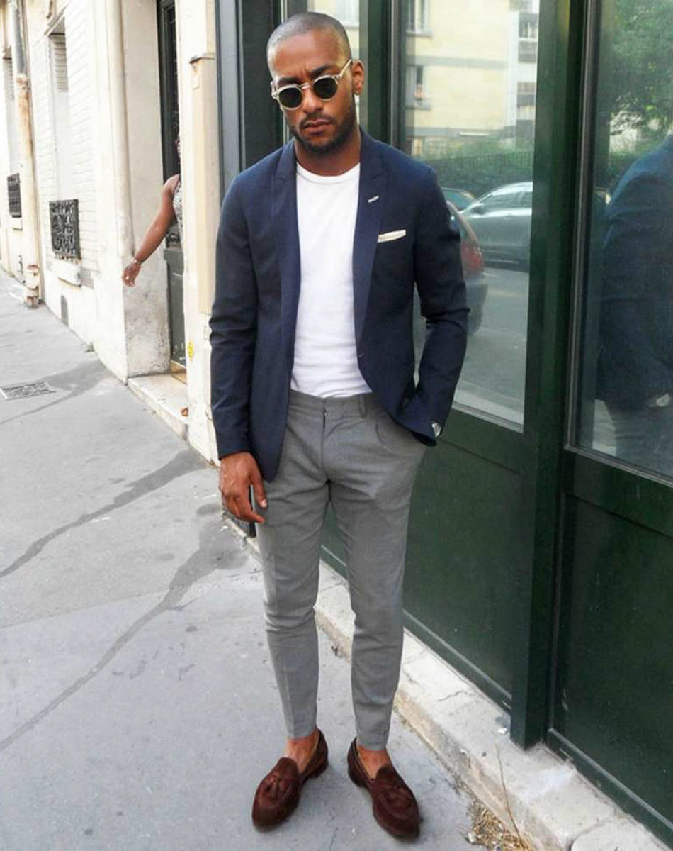 Navy blue blazer, white t-shirt, grey pants, and brown loafers