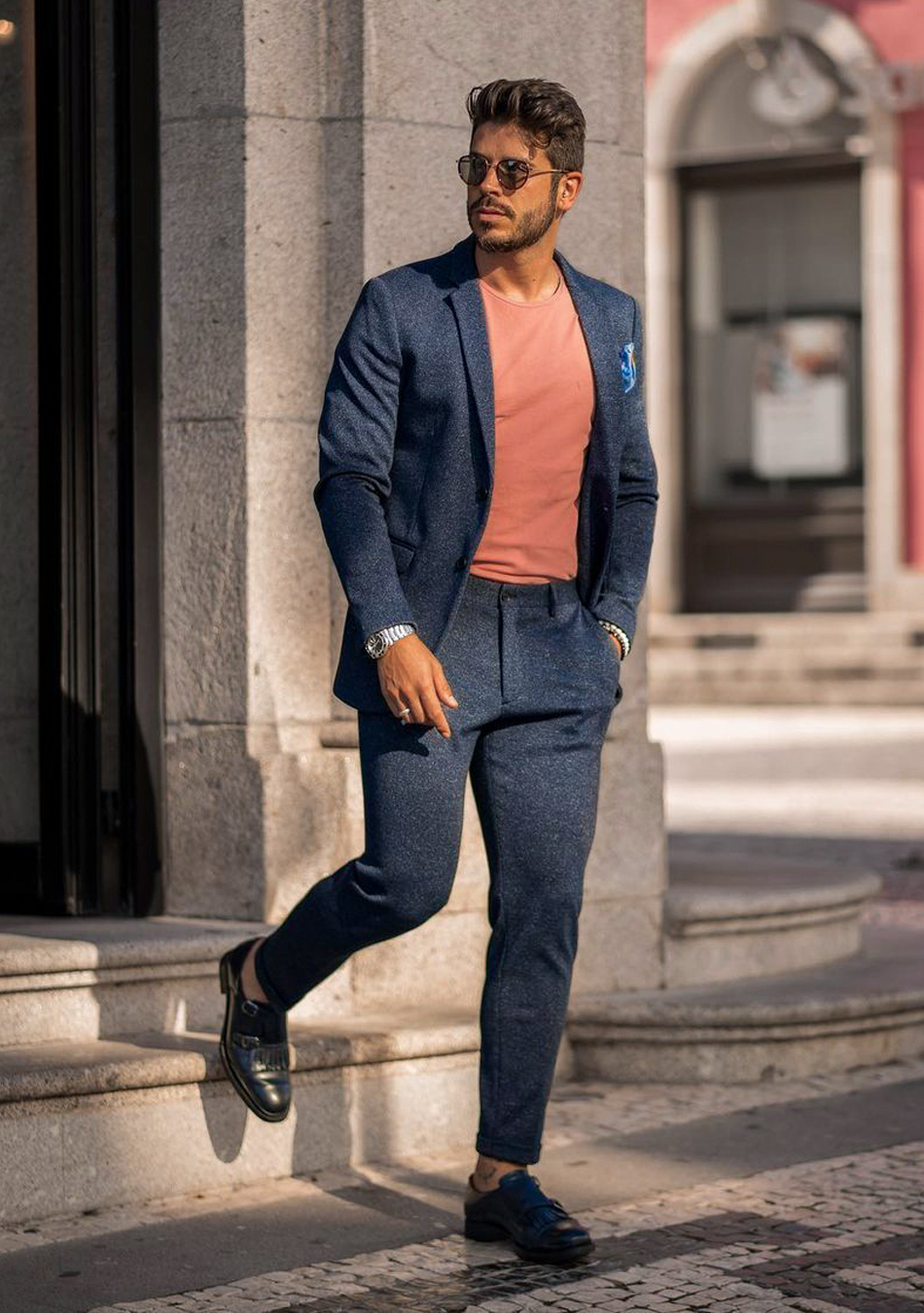 Navy blue suit, orange t-shirt, and black double monks