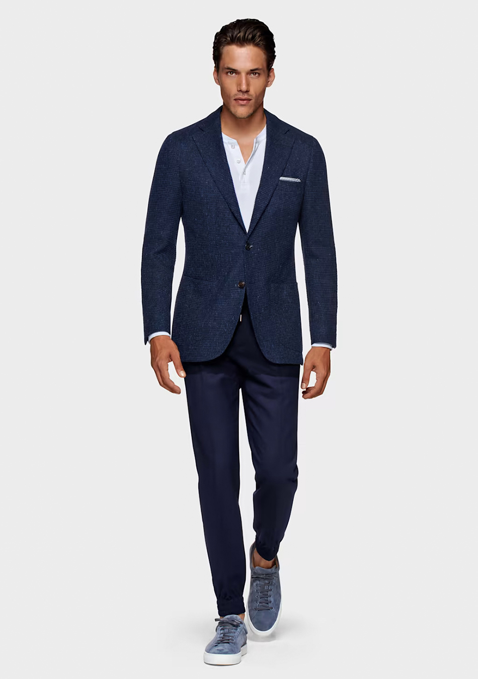 Navy blue suit, white Henley t-shirt, and blue sneakers