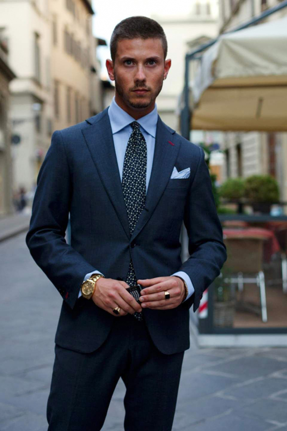 Slim-fit navy suit, blue shirt and dark green tie