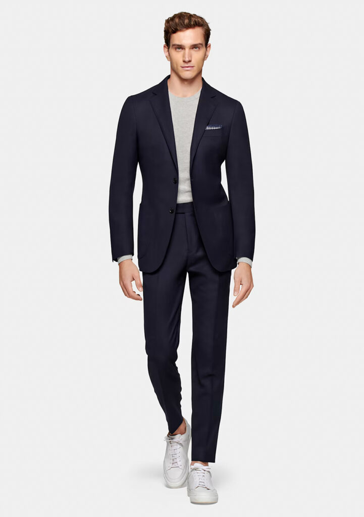 Navy suit store with grey shirt