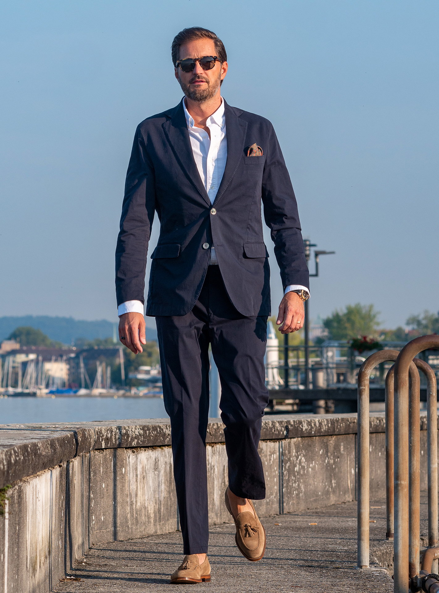 Navy suit with a white shirt and light brown suede loafers
