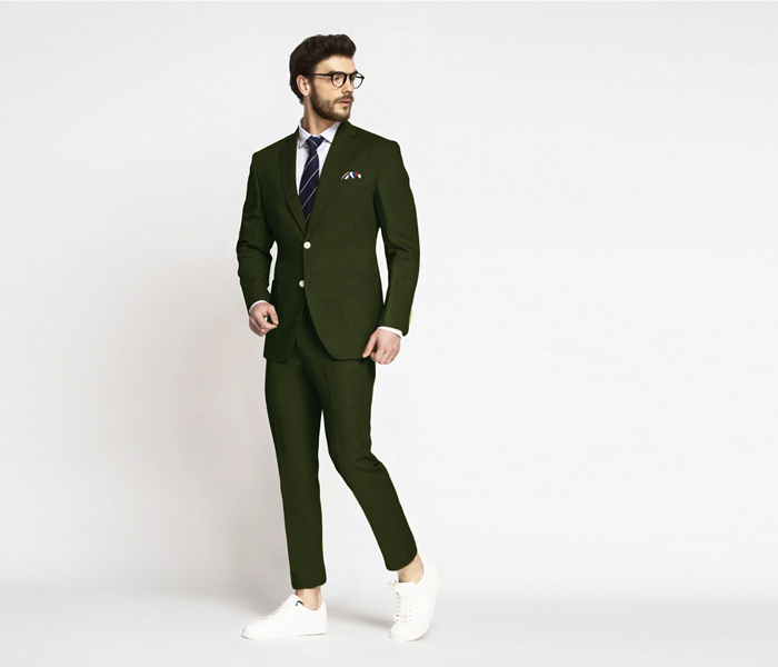 Olive green cotton suit with a white dress shirt and white sneakers