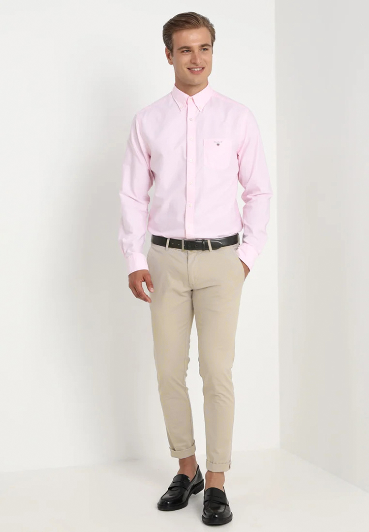Pink dress shirt, khaki pants, and black loafers