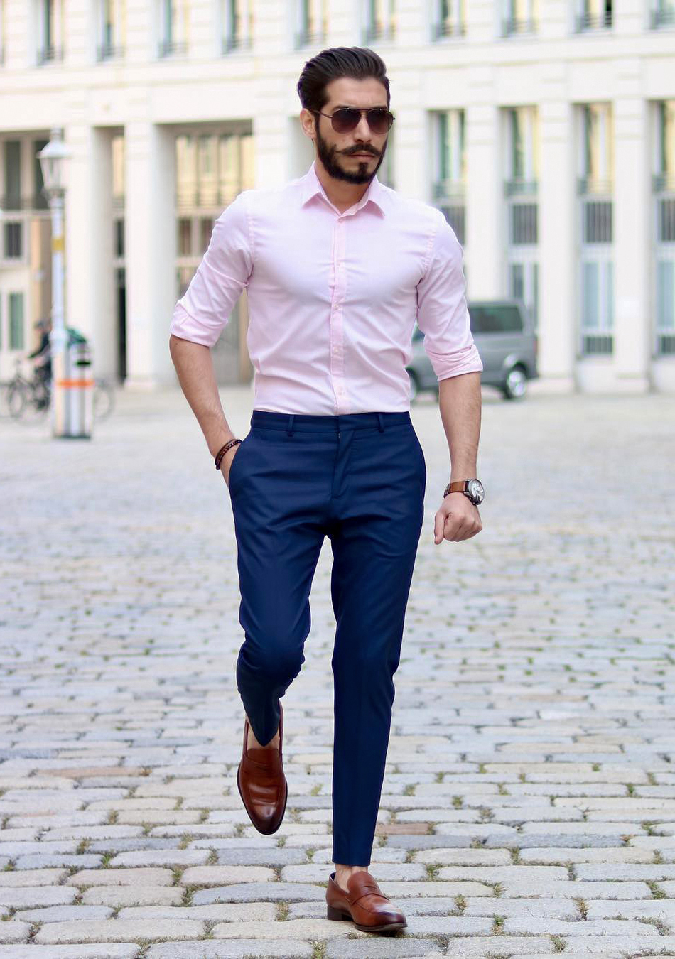 Pink dress shirt, navy chino pants, and brown loafers