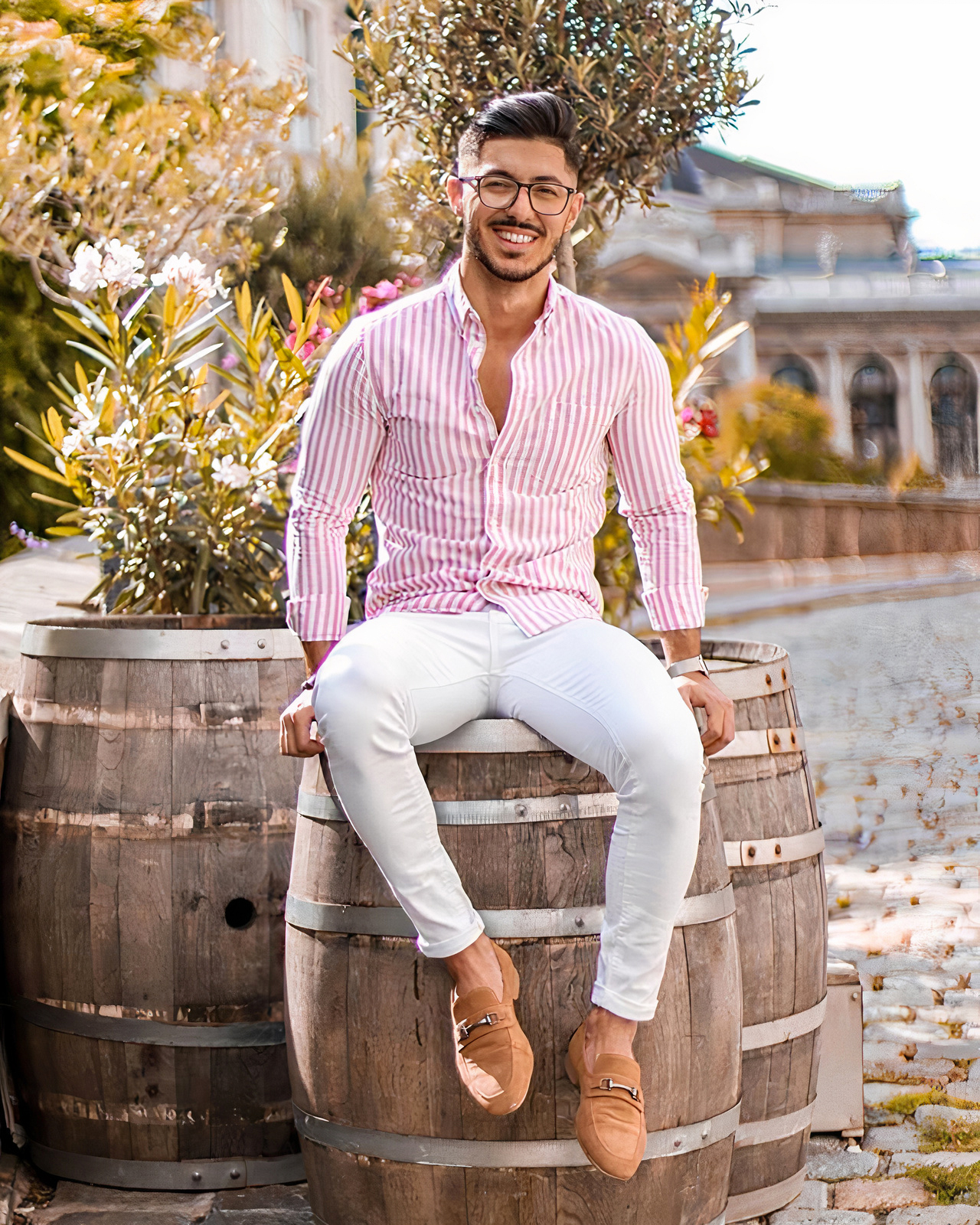 Pink striped shirt, white pants, and brown loafers