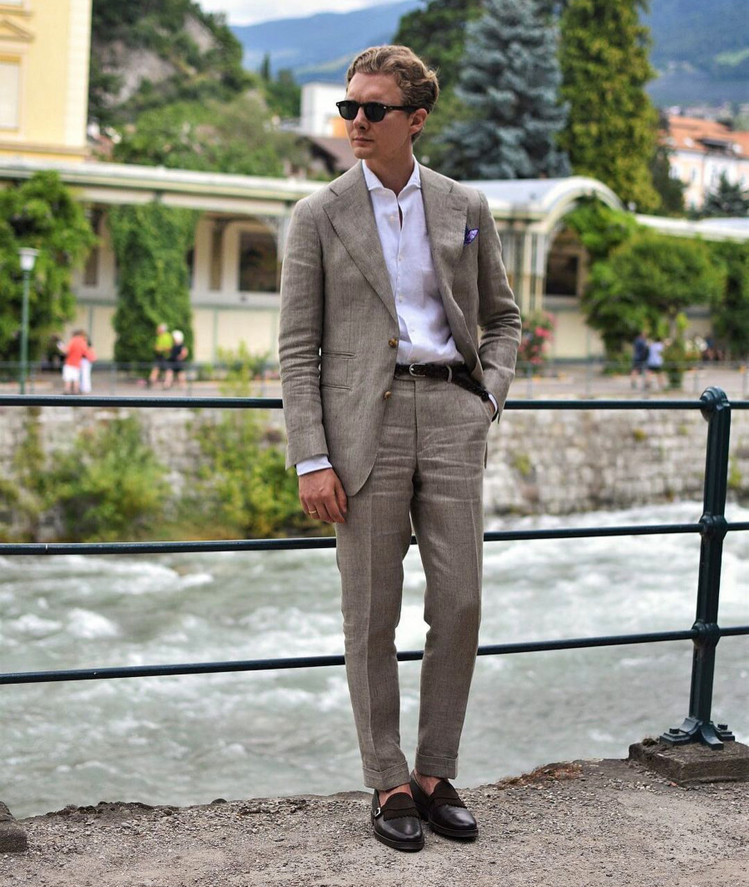 Wearing black belt and black loafer shoes with a tan suit
