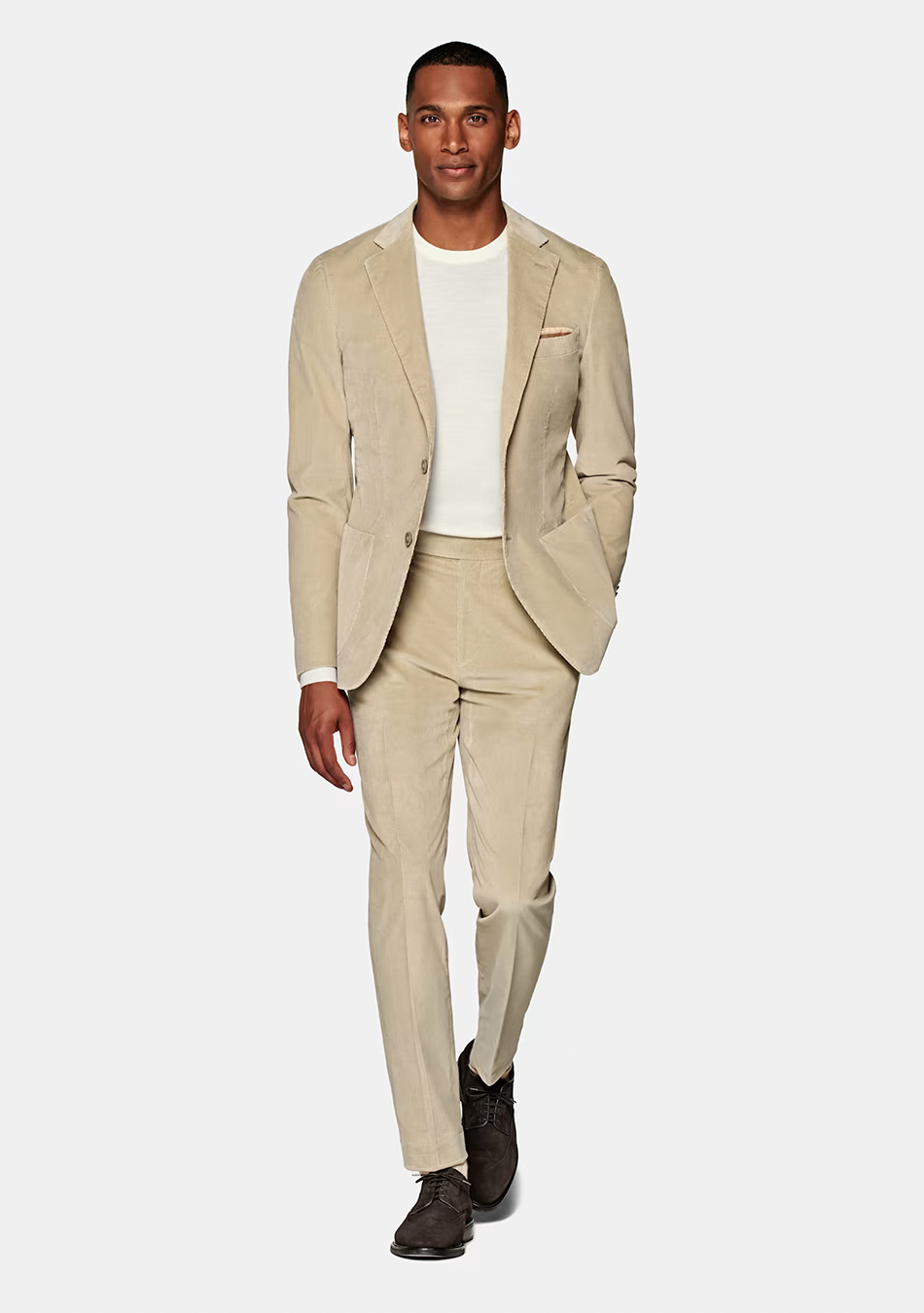 Tan suit. white tee, and brown suede derby shoes