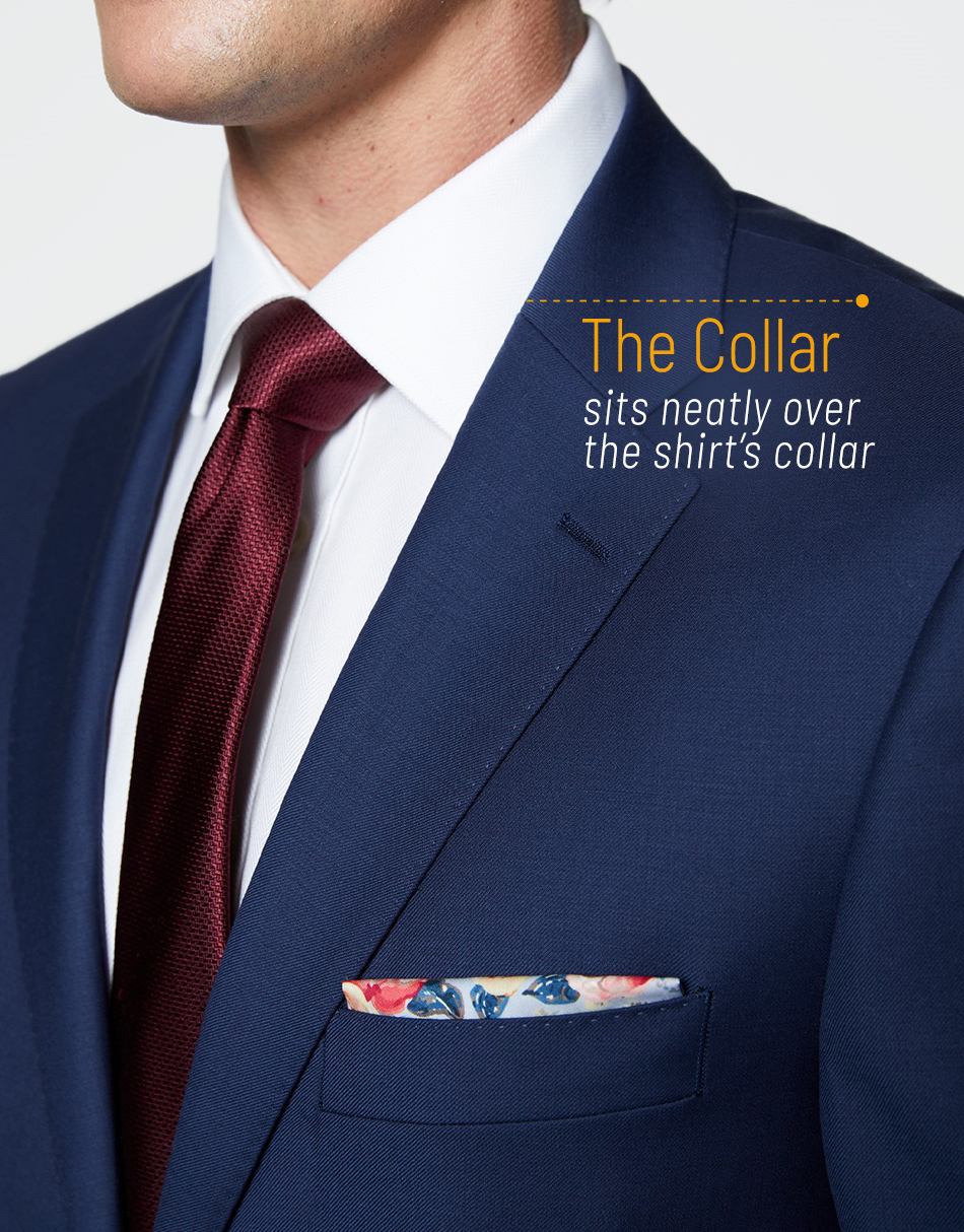 The jacket collar sits neatly over the shirt's collar
