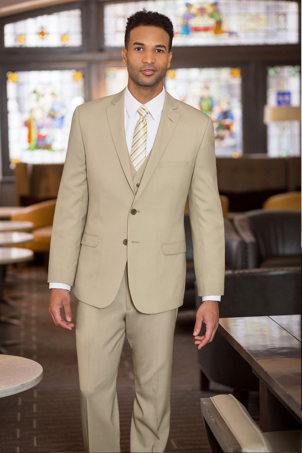 suumer wedding outfit: three-piece tan suit with vest