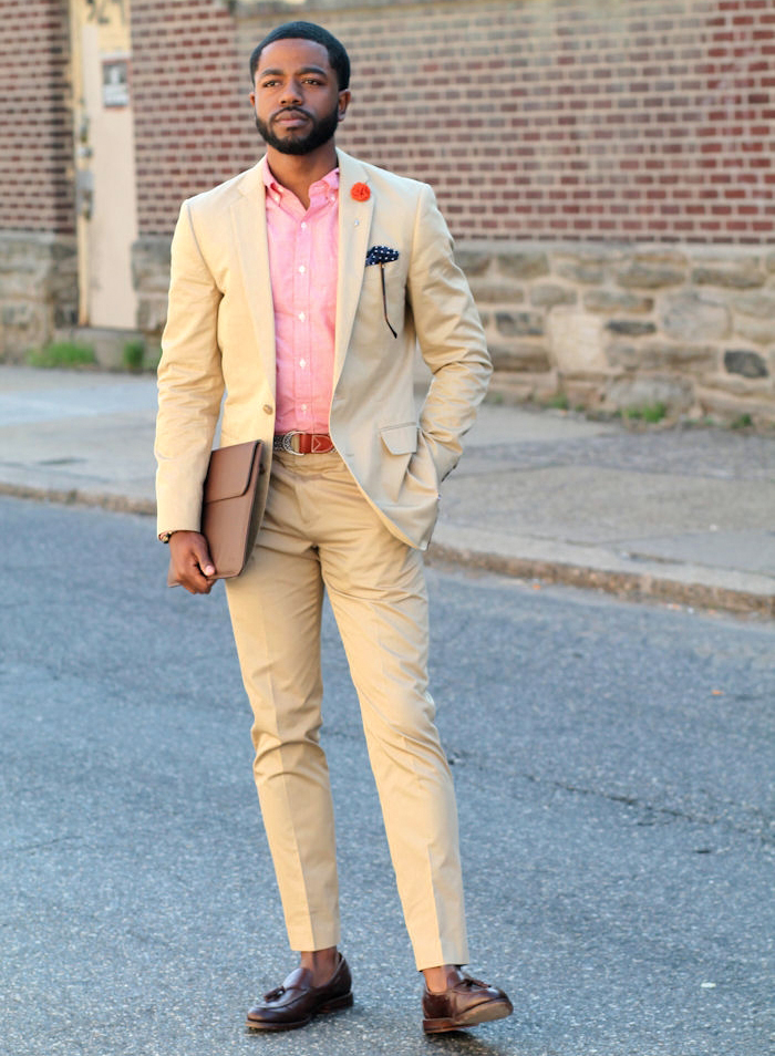 Wearing a khaki suit with a pink shirt and brown loafers