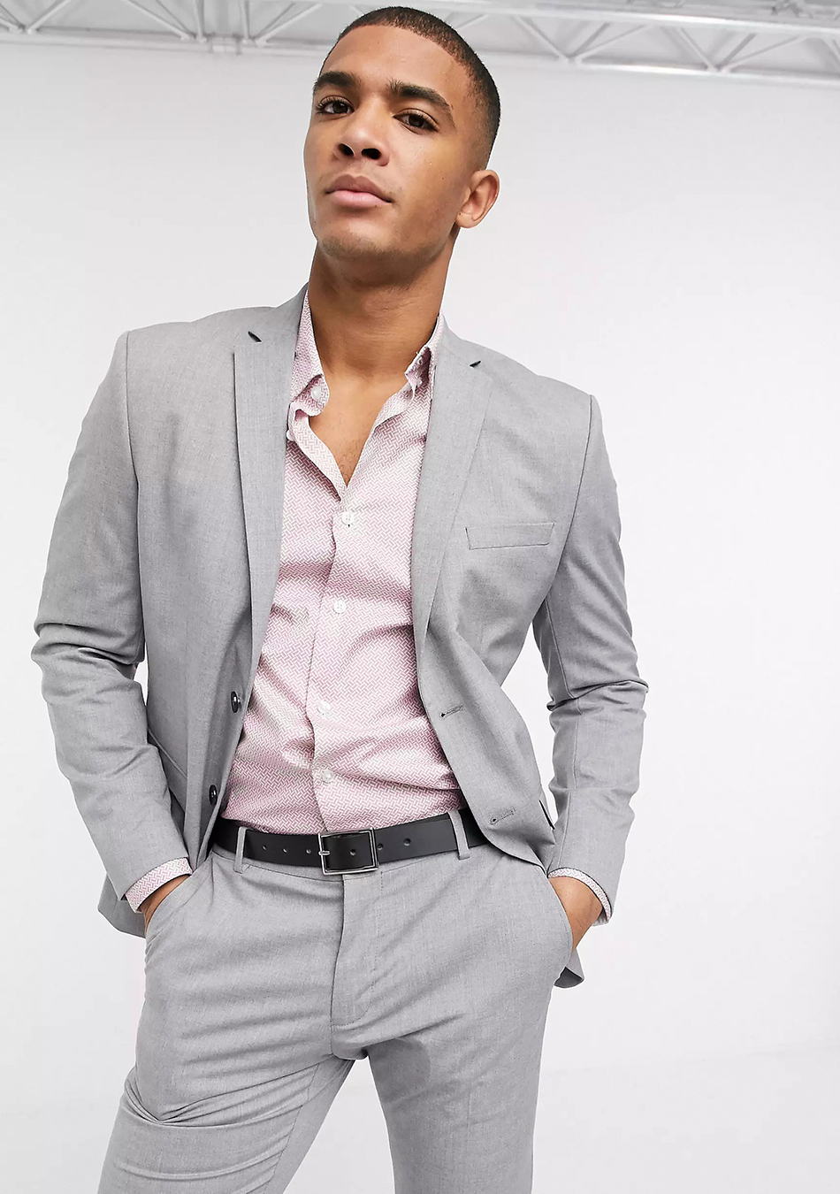 Wearing a light-grey suit with a light pink herringbone pattern shirt