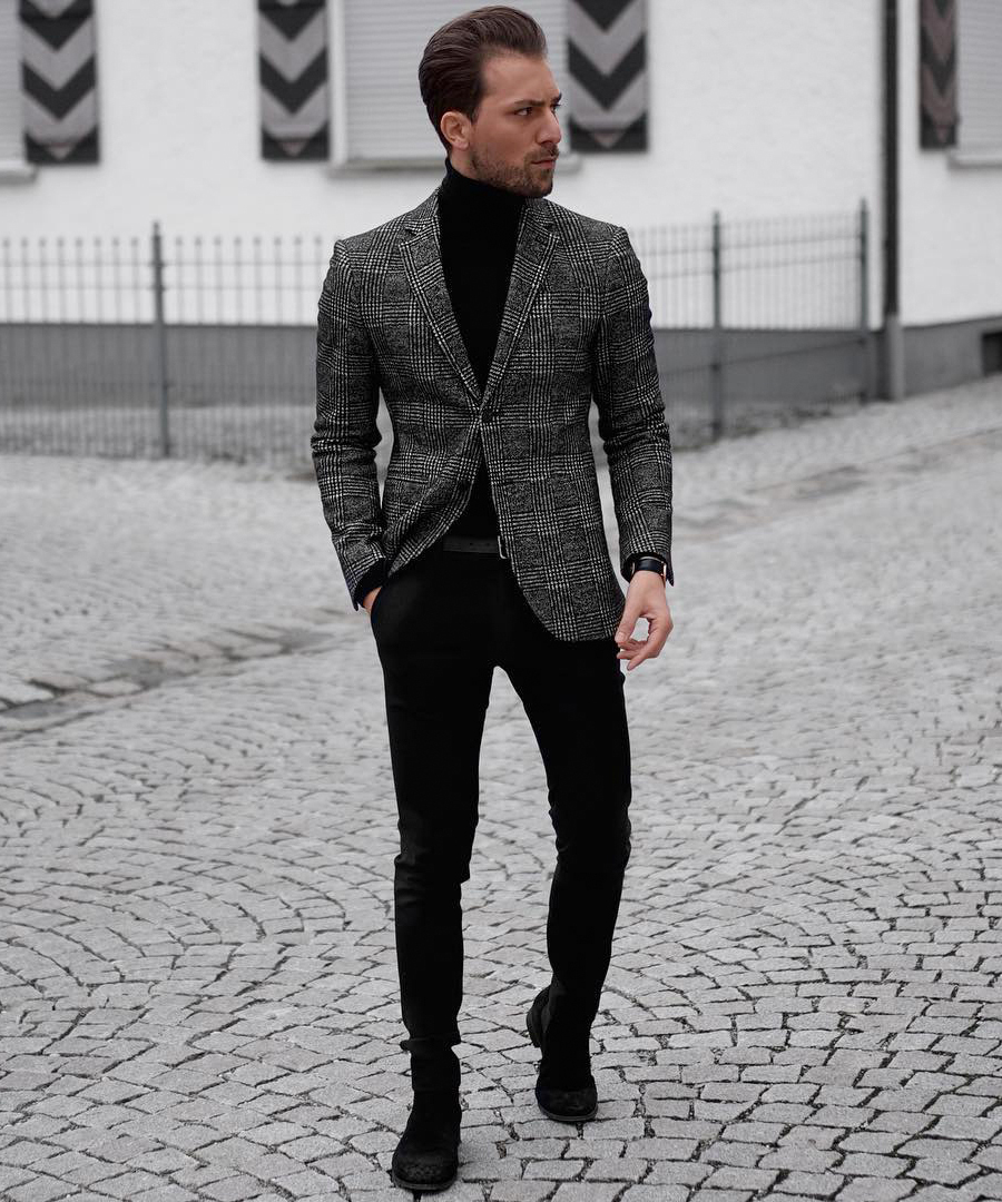 Wearing a patterned grey blazer with black pants and black turtleneck