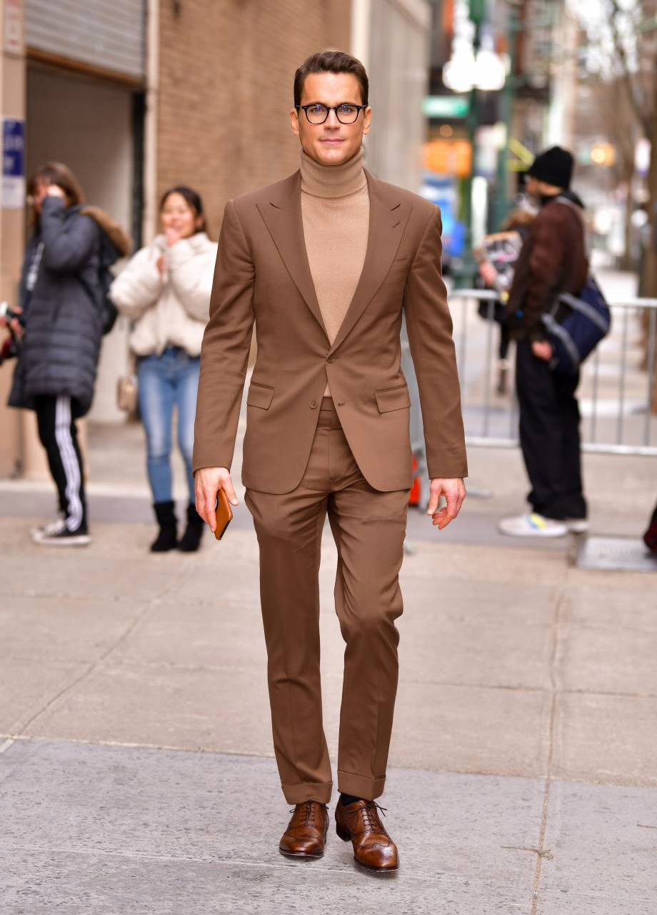 Wearing a brown suit and a tan turtleneck for a job interview