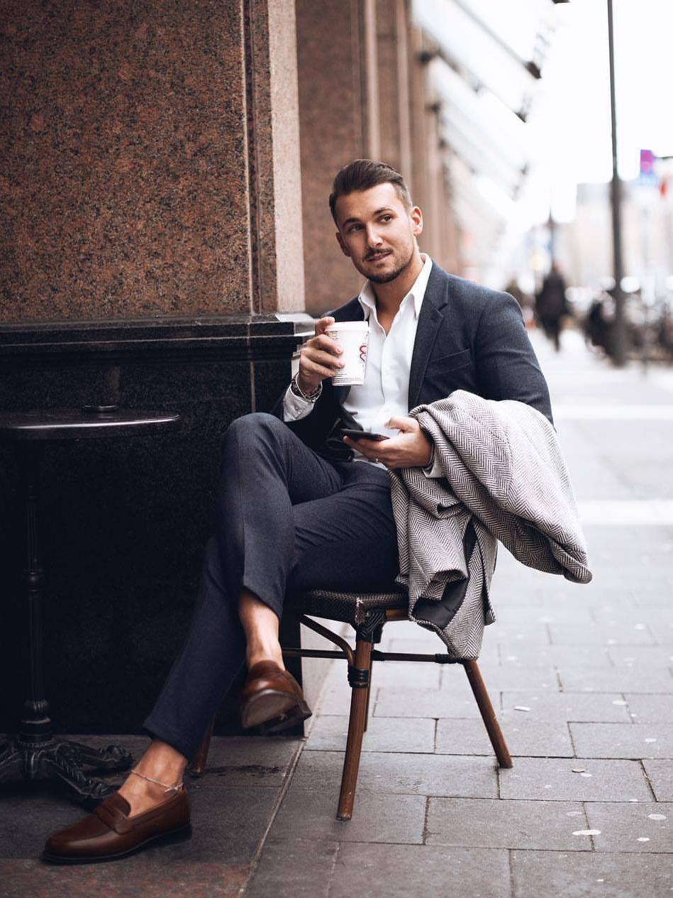 Wearing a charcoal suit with brown loafers