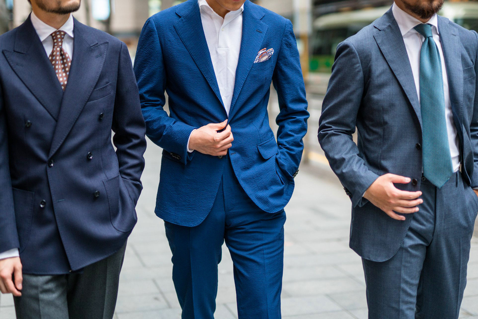 Wearing different shades of blue suits