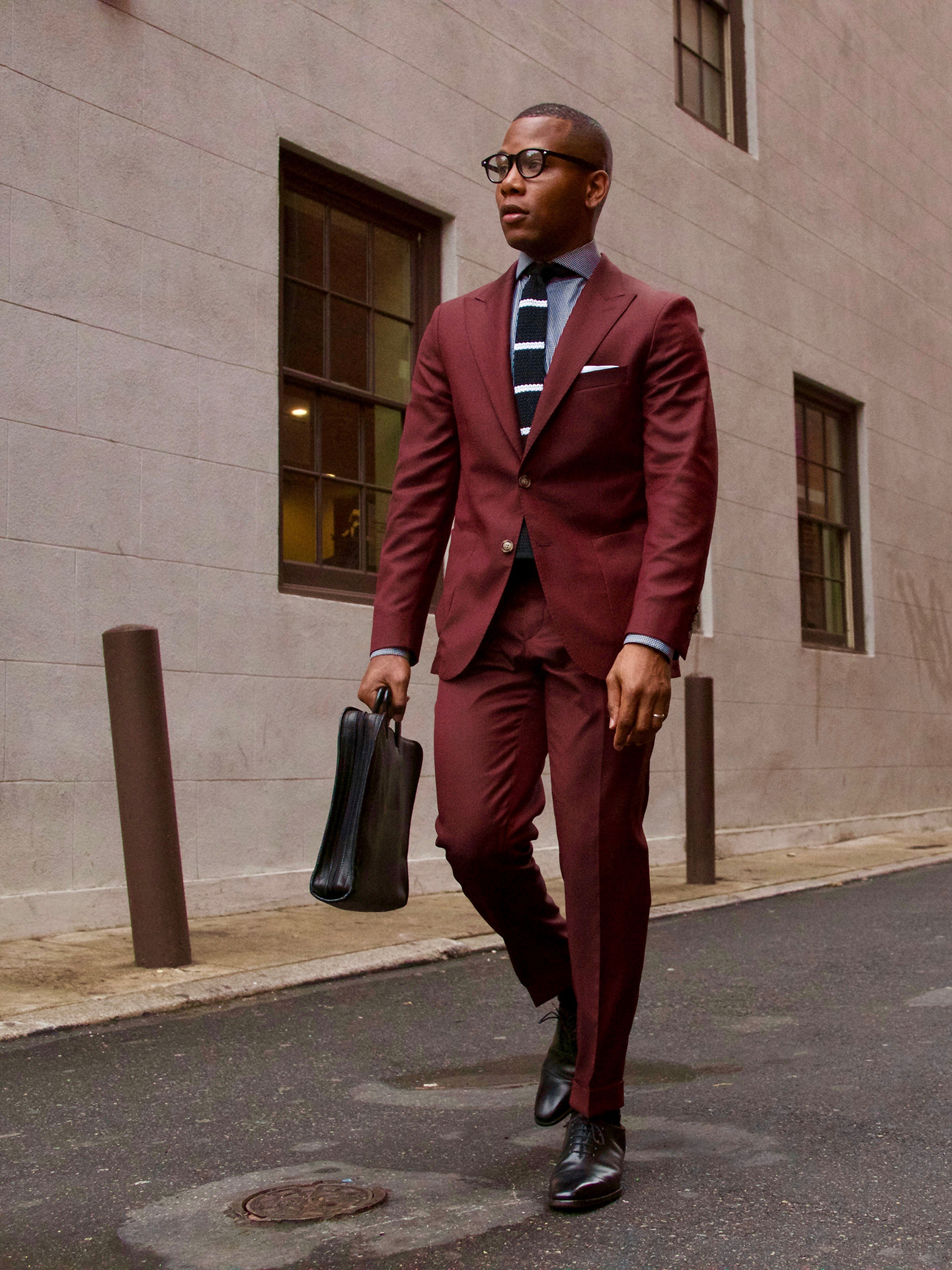 Maroon suit with a blue shirt and dark brown oxford shoes