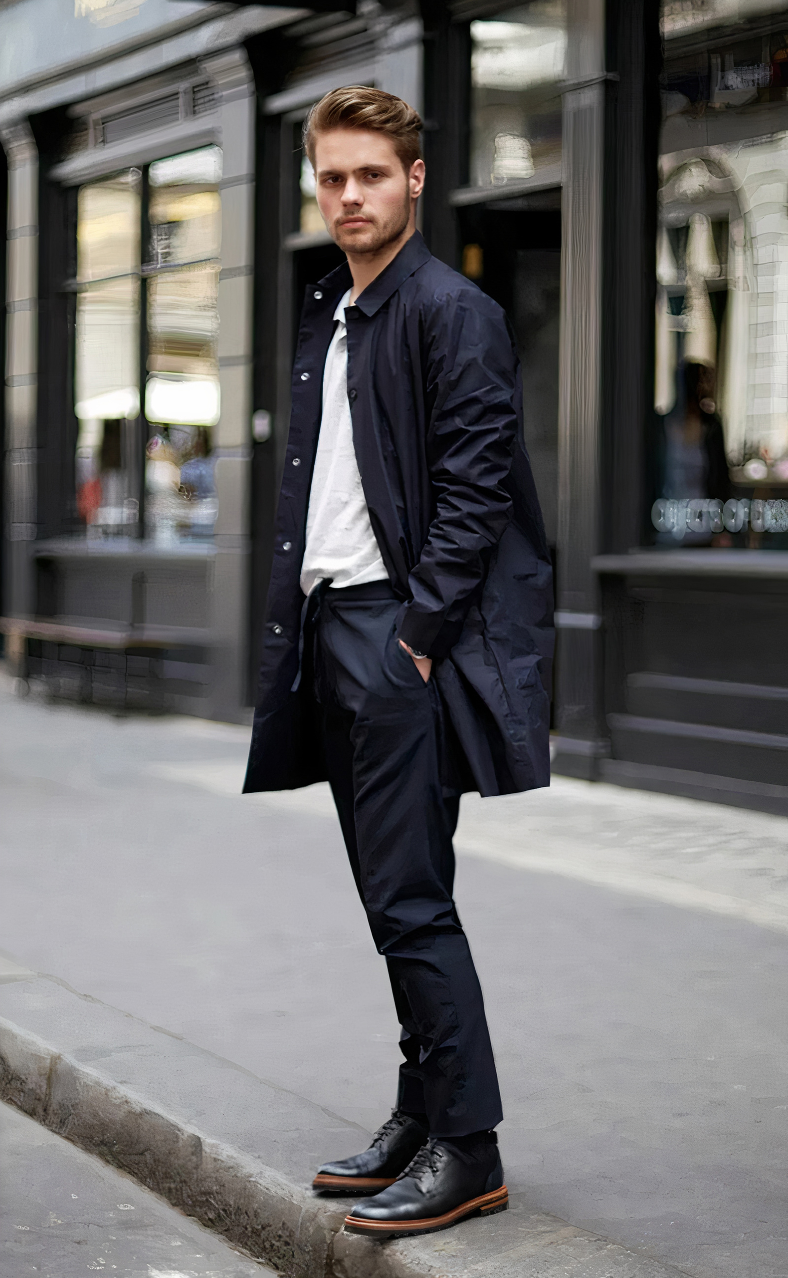 Wearing a navy coat over a white shirt, navy pants, and black shoes
