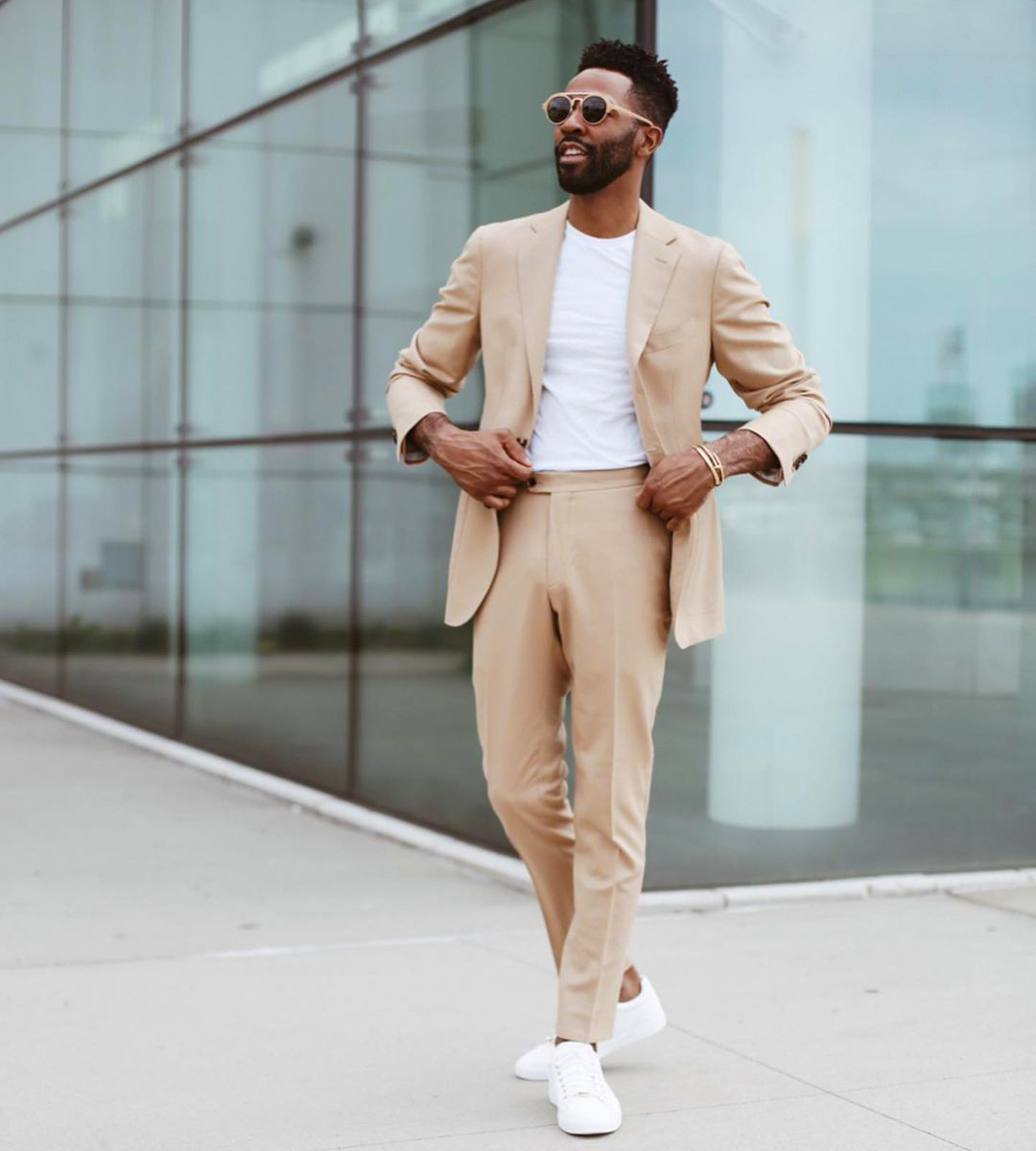 Wearing the tan suit casually with a white t-shirt